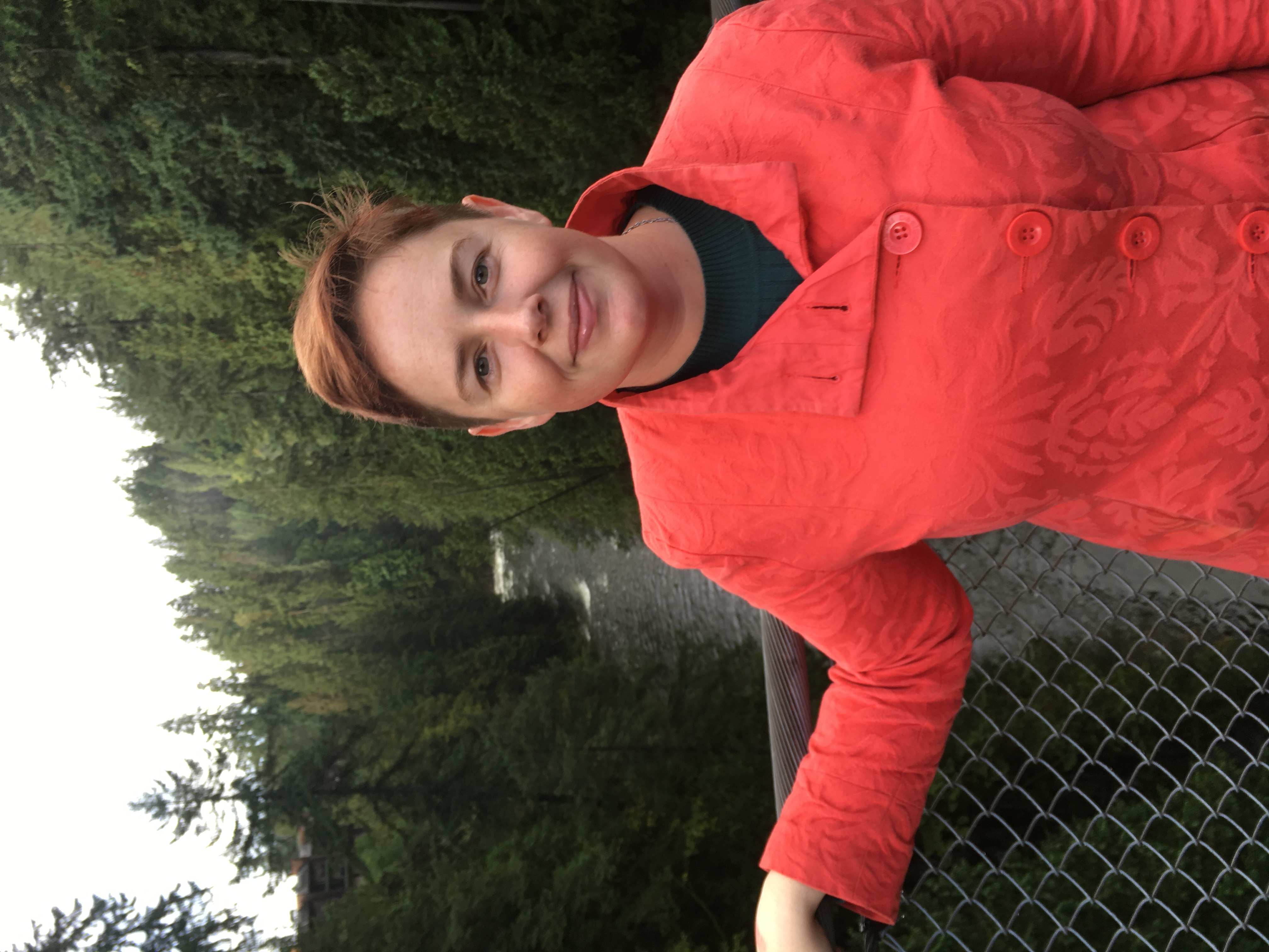 Sheriene Murphy standing in front of a forest